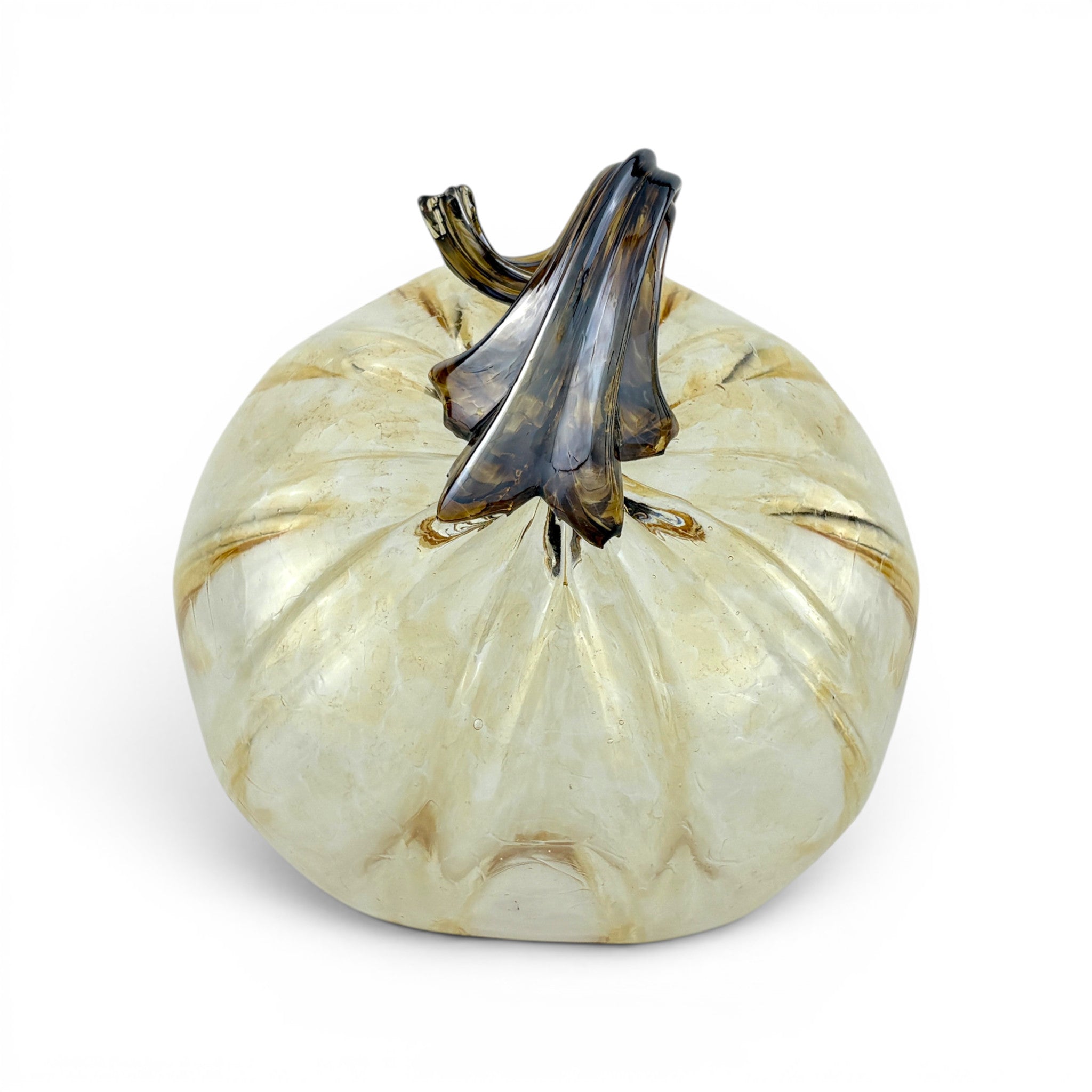 A decorative glass pumpkin with a glossy, marbled cream and gold body and a dark brown stem.