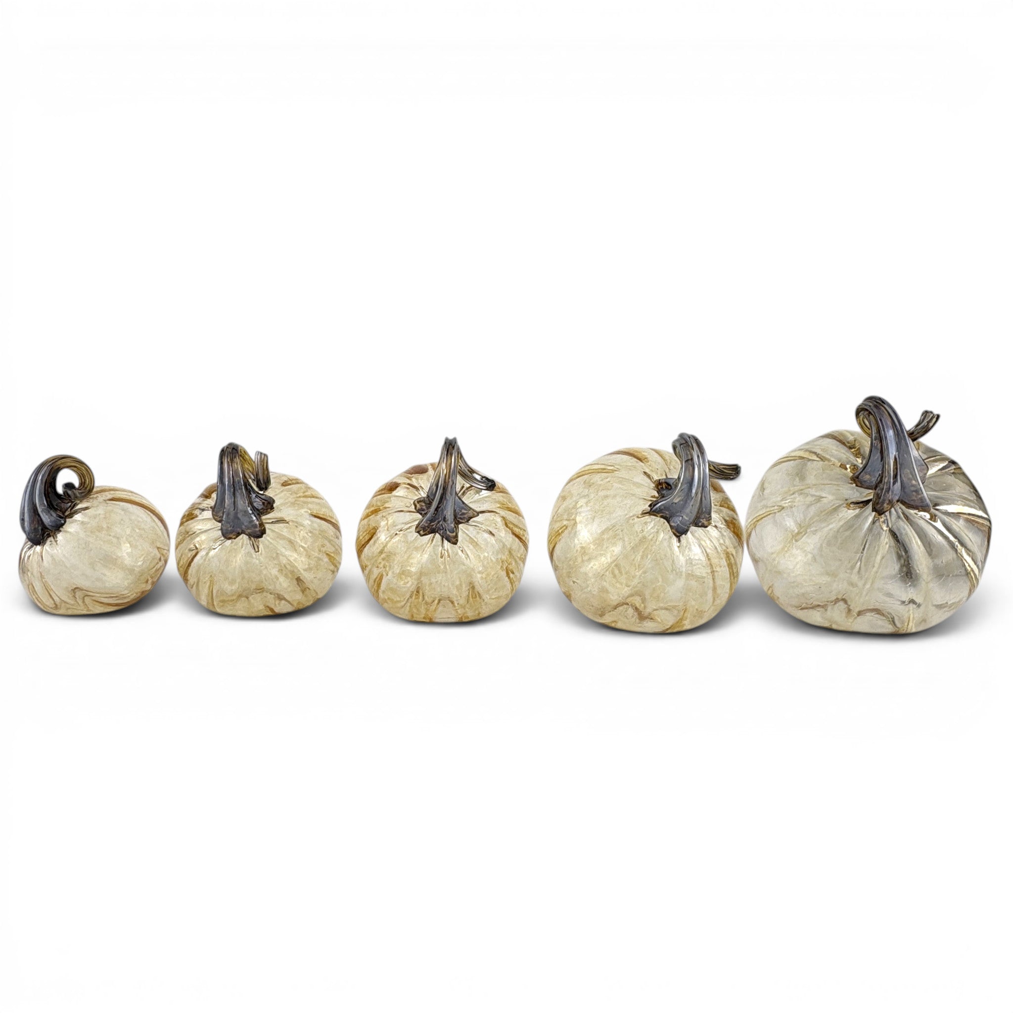 Five decorative glass pumpkins arranged in ascending size order. 