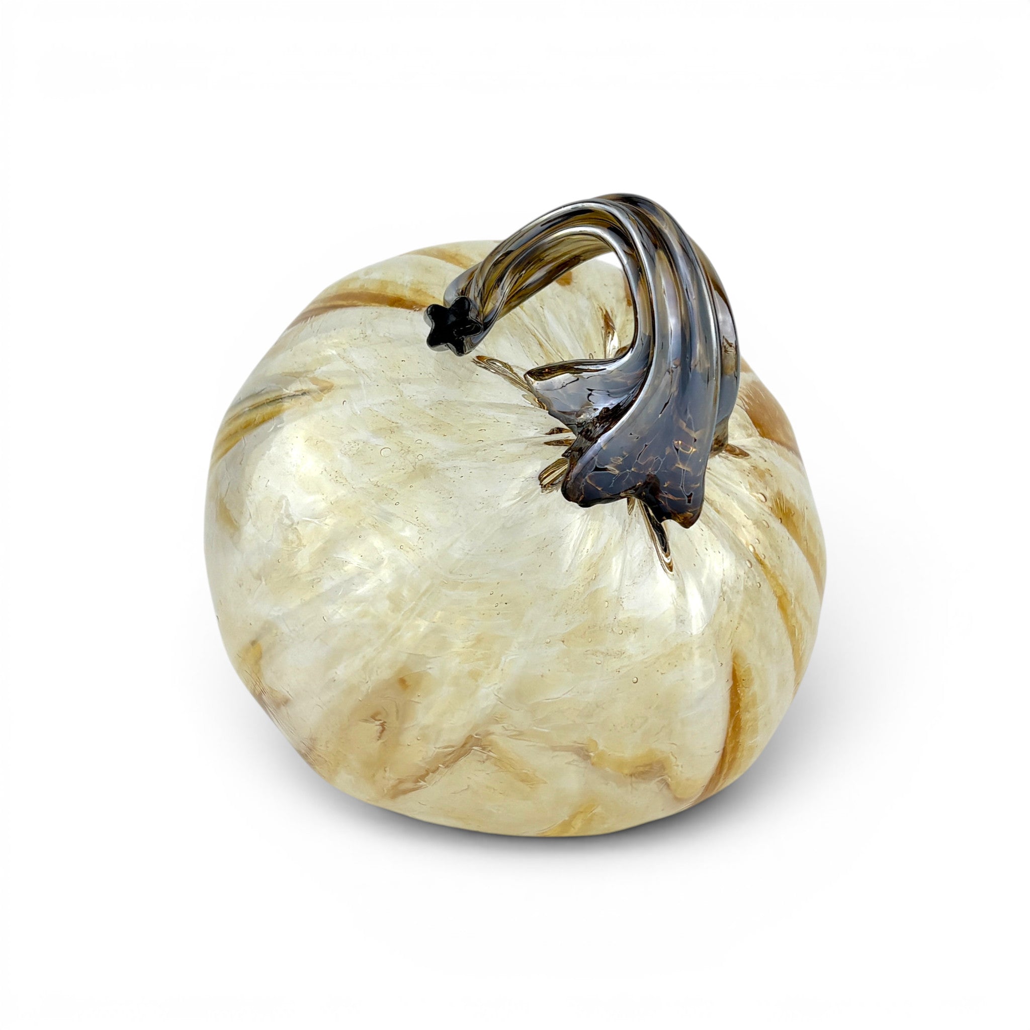 A decorative glass pumpkin with a cream and tan marbled body and a dark smoky-brown stem.