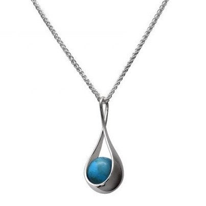 A sterling silver pendant featuring a turquoise accent stone, suspended from a silver chain.