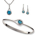 A set of blue topaz jewelry including a bracelet, earrings, and a pendant, all crafted in sterling silver.