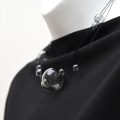 smoked gray glass beads make this necklace modern and stylish