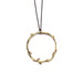 A gold necklace with a round pendant featuring a design of vines and branches, attached to a black sterling chain with a 3-inch extension.