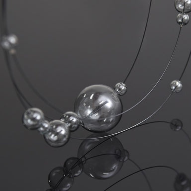 Tinted glass balls on a necklace with magnetic clasp