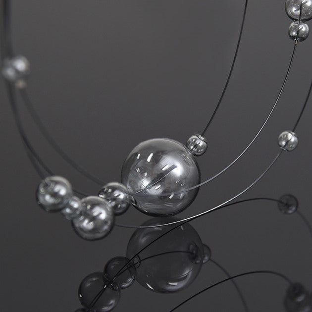 Tinted glass balls on a necklace with magnetic clasp