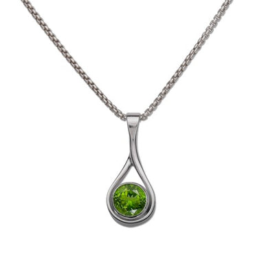 stunning peridot gemstone in a handcrafted sterling silver setting, hanging from an 18" sterling silver chain
