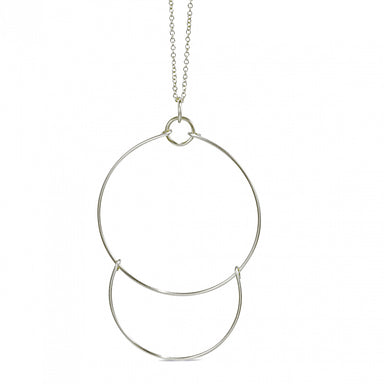 A sterling silver wire necklace with a geometric two-piece pendant and chain.