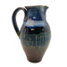 A north carolina pottery stoneware pitcher with a blue pattern .