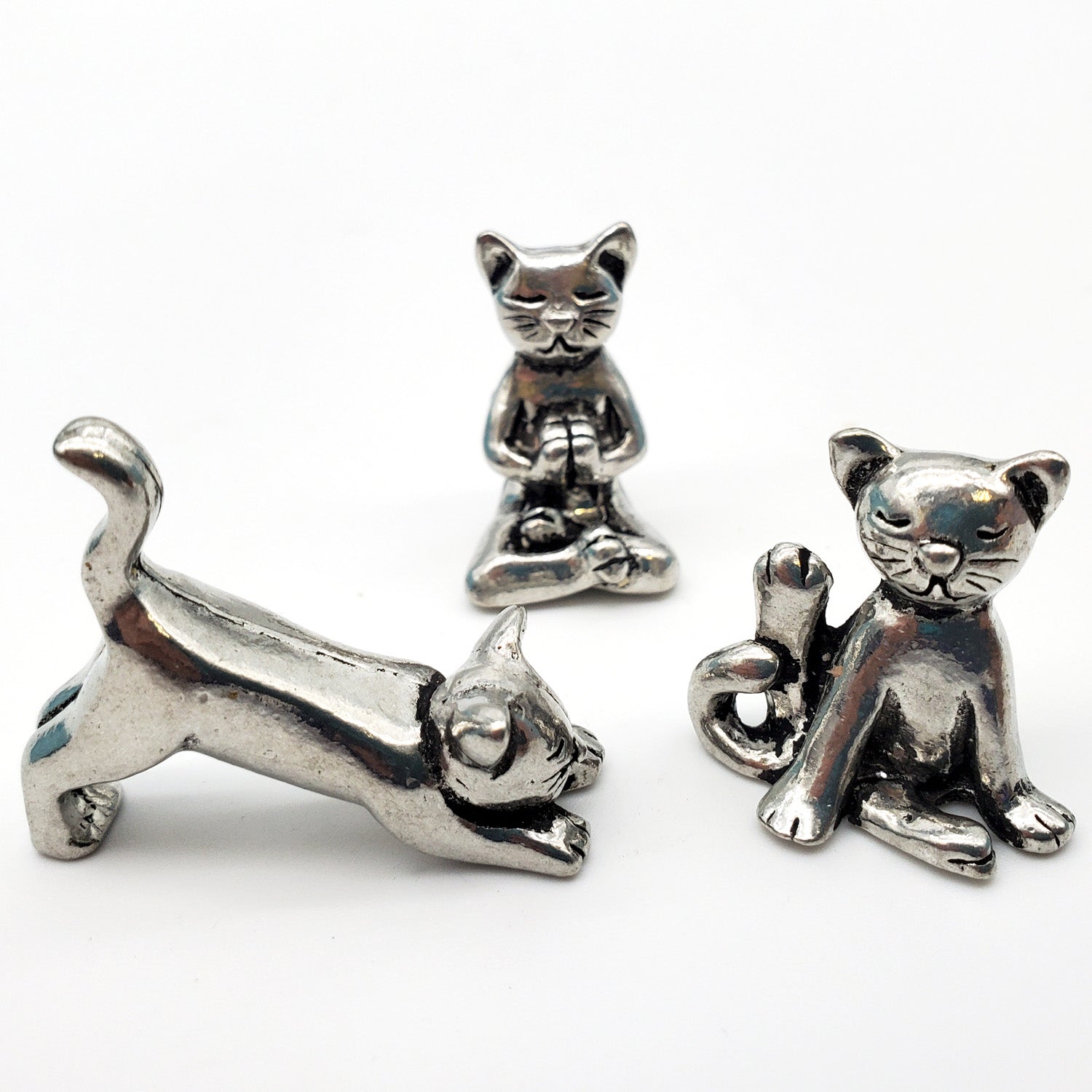 cat figurines crafted in pewter holding yoga poses