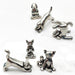 A collection of handcrafted pewter sculptures in the form of cats and dogs in various yoga poses.